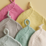 Top Knot Baby Hat free Top Knot Baby Hat knitting pattern in Purl Soho's Morning yarn